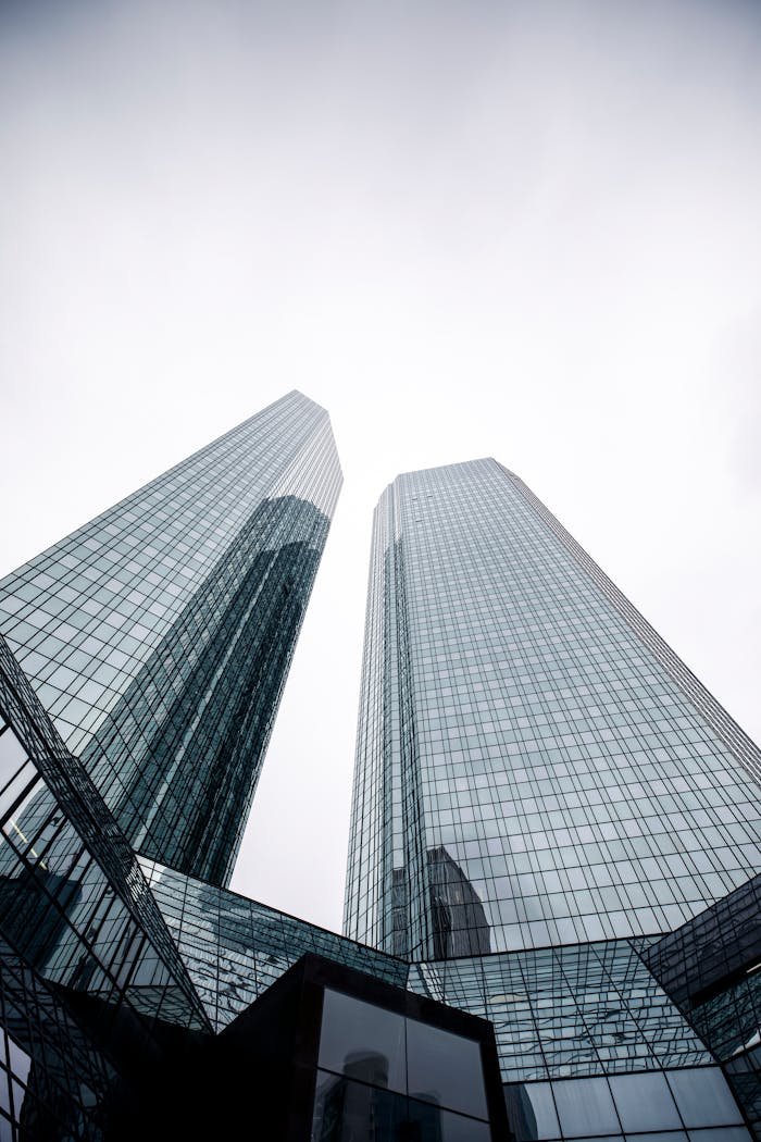 Low angle shot of modern skyscrapers with glass facades in Frankfurt, Germany.