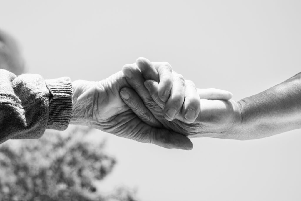 mita 64 mm8aq9bjina unsplash Clasped hands of two people helping each other